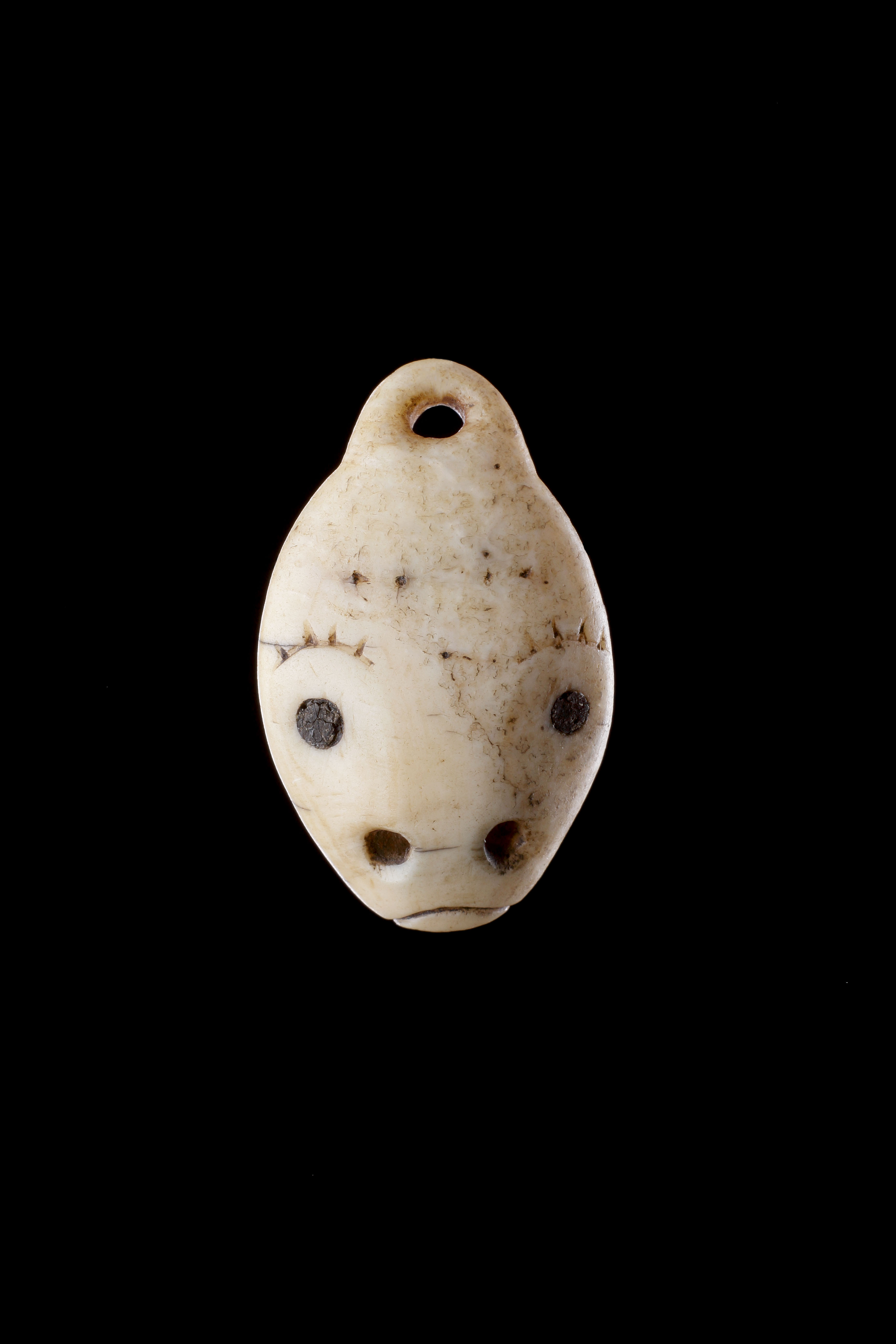 Bering Strait Inuit belt fastener in the form of an anthropomorphic seal’s face